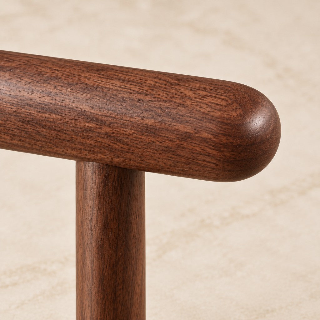 Solid walnut, rounded where straps rest