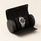 Black 1-slot watch roll open with a watch on its black pillow