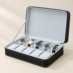 10-slot zippered faux leather watch box in black, open with five watches