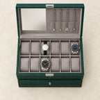 Top view of the open 12-slot green watch and jewelry box with watches of different sizes