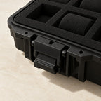 Close-up of the flip latch and foam compartments of the protective watch case