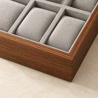 Close-up of the walnut grain frame and gray velvet-touch pillows