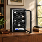 12-watch winder cabinet on a wooden sideboard beside a valet tray and books