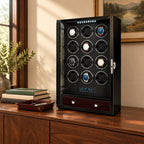 12-watch winder cabinet on a wooden sideboard beside a valet tray and books