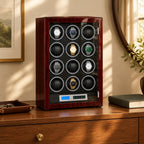 12-watch winder cabinet on a wooden chest of drawers beside a valet tray and a book