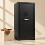 Black steel winder safe closed, beside a fountain pen and leather gloves