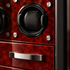 Close-up of a cushioned winder in the burl-wood interior and a drawer handle