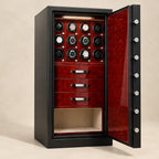 Steel watch winder safe open, with twelve winders, three burl-wood drawers and storage