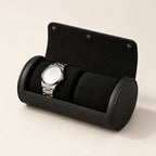 Black 2-slot watch roll open with a watch on a black pillow