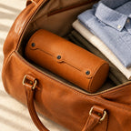 2-slot watch roll packed in a leather weekender bag, for scale