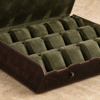 Close-up of the olive velvet cushions and snap button of the 20-slot leather case