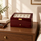 20-slot wine red lacquered watch box on a wooden chest of drawers