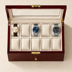 Top view of the wine red watch box with three watches of different sizes