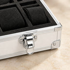 Close-up of a foam pillow and metal latch of the aluminum watch case