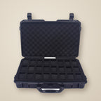 Top view of the 24-slot hard-shell case with three watches of different sizes