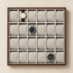Top view of the 24-slot watch tray with three watches of different sizes