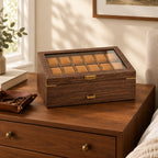 24-slot walnut wood-grain watch box on a wooden chest of drawers