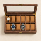 Top view of the 24-slot walnut watch box with three watches of different sizes