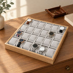 24-slot wooden watch tray on a wooden chest of drawers