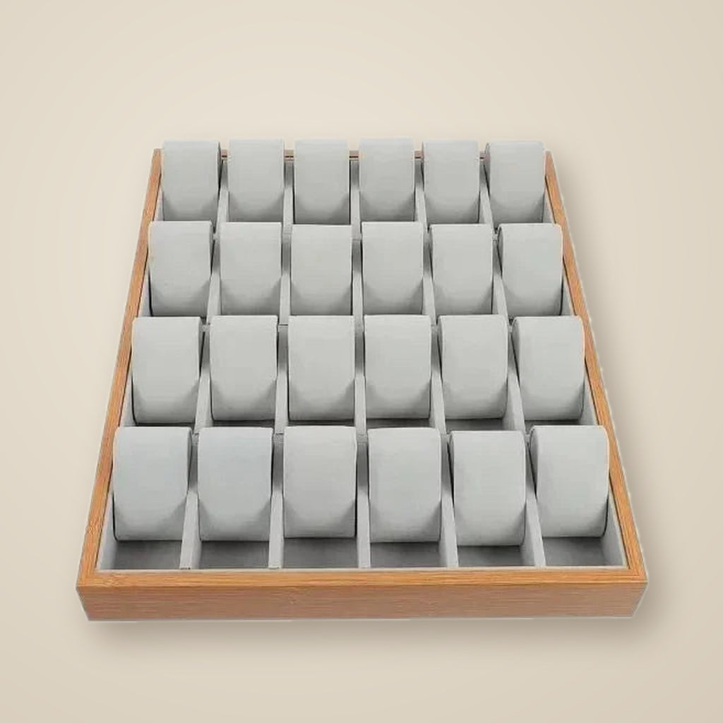 Top view of the 24-slot wooden tray with three watches of different sizes