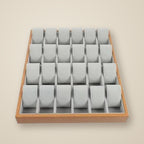 Top view of the 24-slot wooden tray with three watches of different sizes