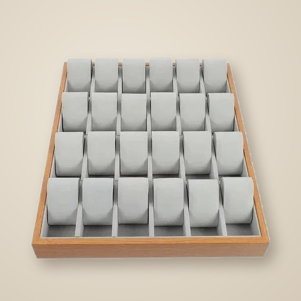 Top view of the 24-slot wooden tray with three watches of different sizes