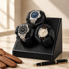 3-slot watch winder beside a fountain pen and leather gloves