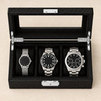 Top view of the 3-slot carbon-pattern watch box with watches of different sizes