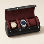3-slot black faux leather watch roll with burgundy interior, open