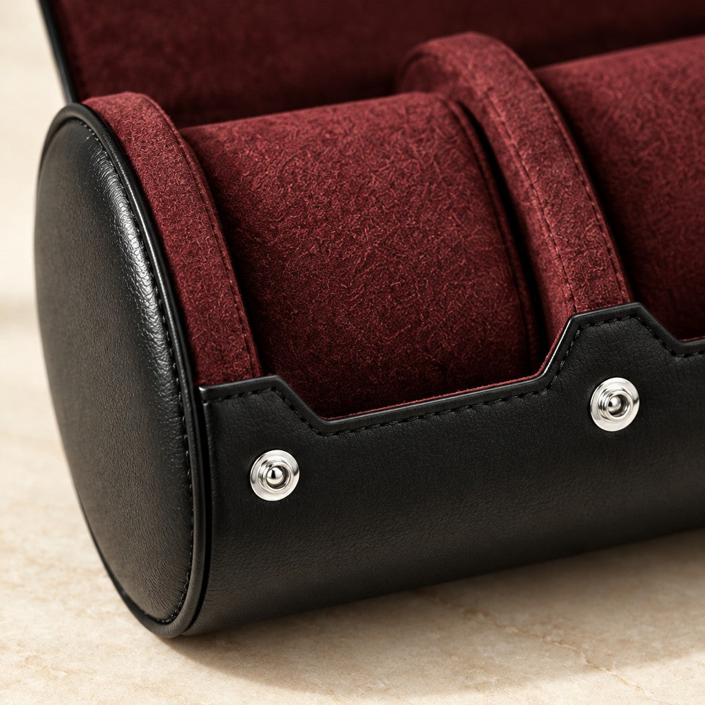 Close-up of the burgundy pillows and snap studs of the watch roll
