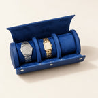 3-slot navy watch roll open, two watches on blue velvet pillows