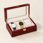 3-slot red lacquered watch box with the glass lid open and two watches