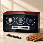 3-watch winder beside a fountain pen and leather gloves