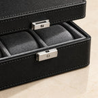 Close-up of the stitched black finish and metal clasp of the 4-slot watch box