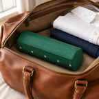 Hexagon watch case packed in a leather weekender bag, for scale