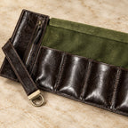 Close-up of the lining and hardware of the 4-slot leather roll-up watch pouch