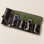 4-slot leather roll-up watch pouch open, watches on its pillows