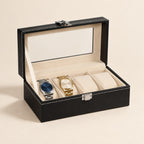 4-slot black faux leather watch box with glass window, open with two watches