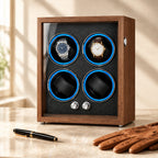 4-watch winder cabinet closed, beside a fountain pen and leather gloves