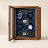 Walnut 4-watch winder cabinet with the glass door open and two watches on the rotors