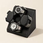 4-watch winder in black woven faux leather with two watches on its turntable