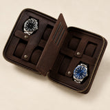 4-watch zippered travel case in dark brown leather, open flat with two watches