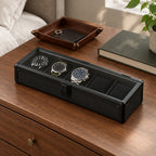 The 5 slot aluminum watch box on a chest of drawers, for scale