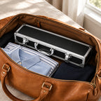 The 5 slot aluminum watch case packed in a leather weekender bag, for scale