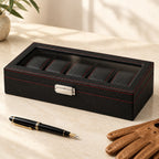 5-slot carbon-pattern watch box closed, beside a fountain pen and leather gloves