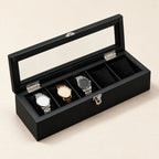 5-slot black wooden watch box with the glass lid open and three watches