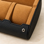 Close-up of the camel pillows and a snap stud on the crosshatch leather