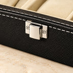 Close-up of the chrome clasp and stitched faux leather of the 6-slot watch box