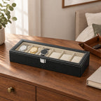 The 6 slot faux leather watch box on a chest of drawers, for scale