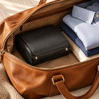 6-slot watch travel case packed in a leather weekender bag